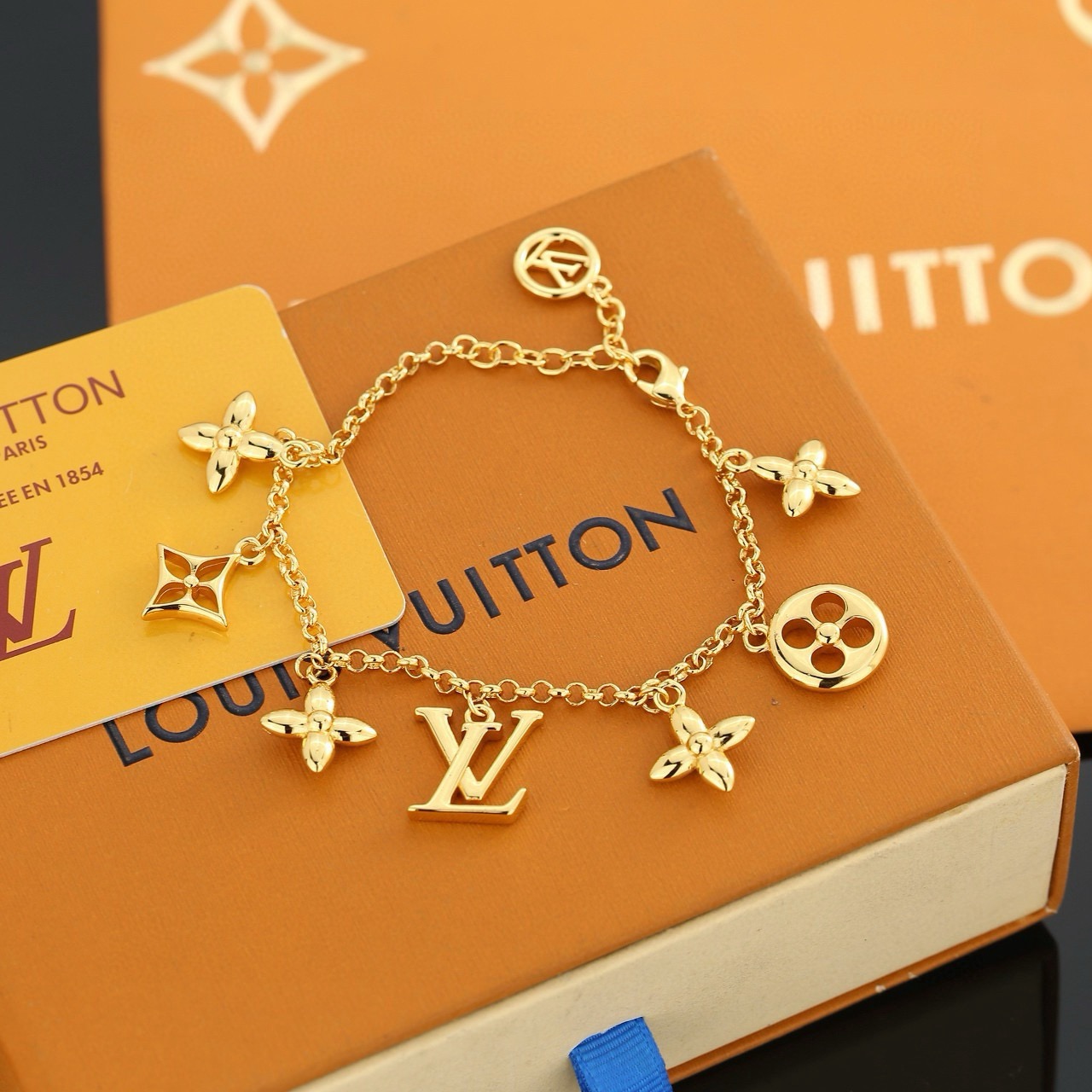 louis vuitton gold lv twig charm bracelet