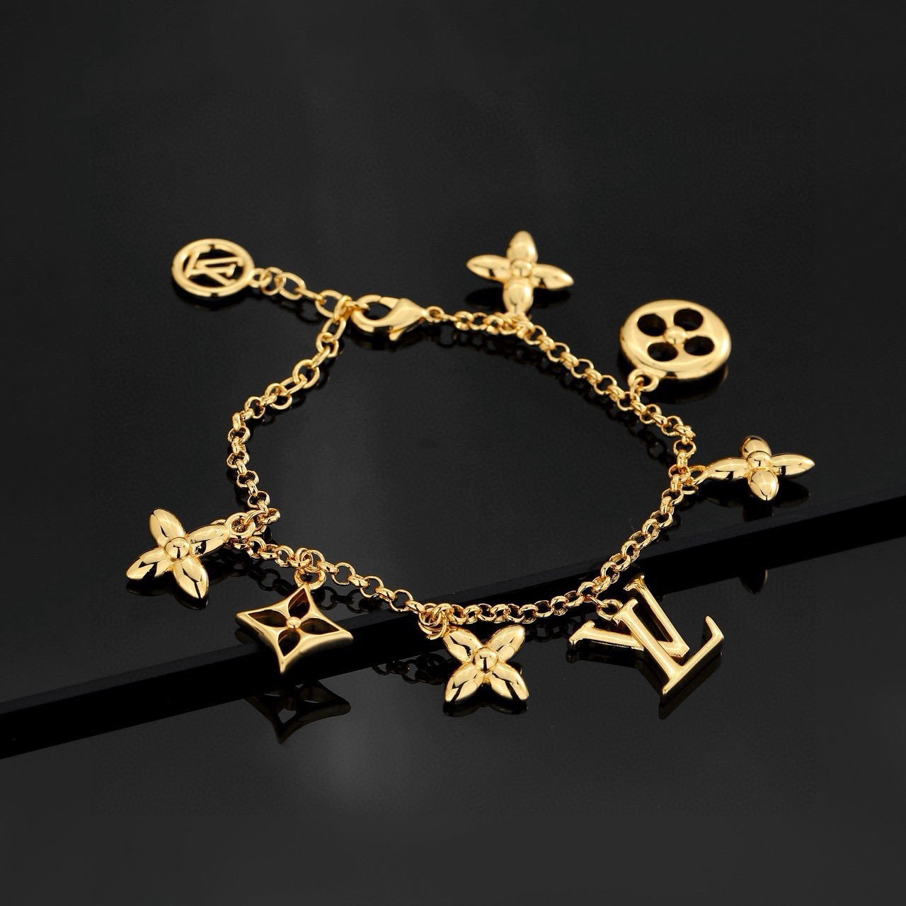 louis vuitton gold lv twig charm bracelet