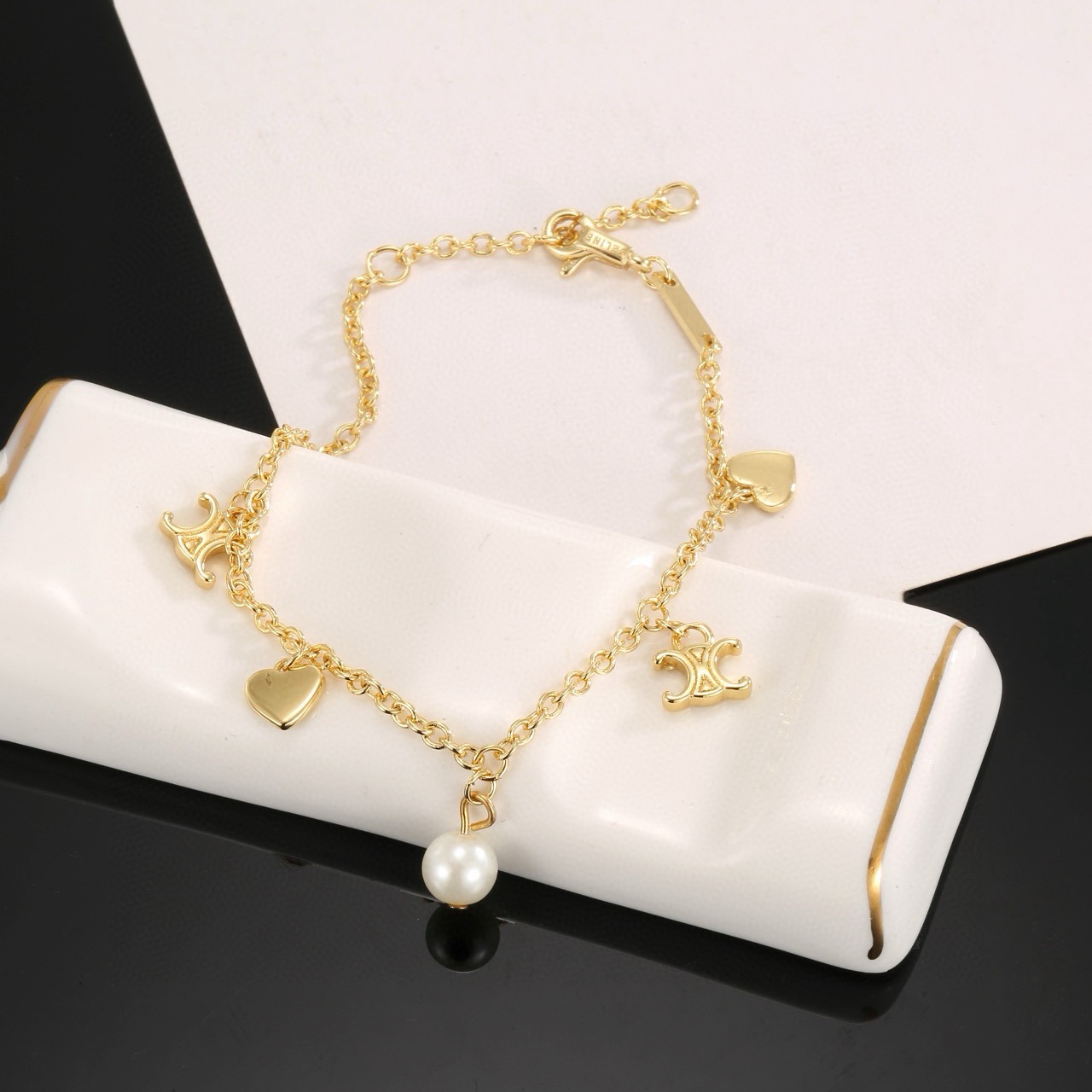 Celine Triomphe Heart Pearl Charm Bracelet bracelet gold-tone metal with white faux pearl 18cm with 3cm extender