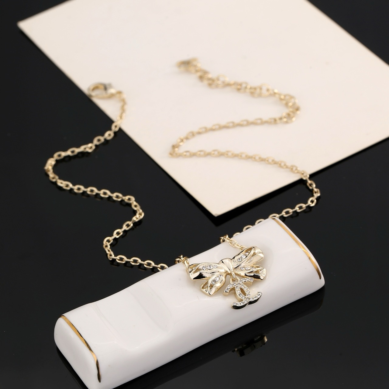 chanel gold crystal bow pendant necklace