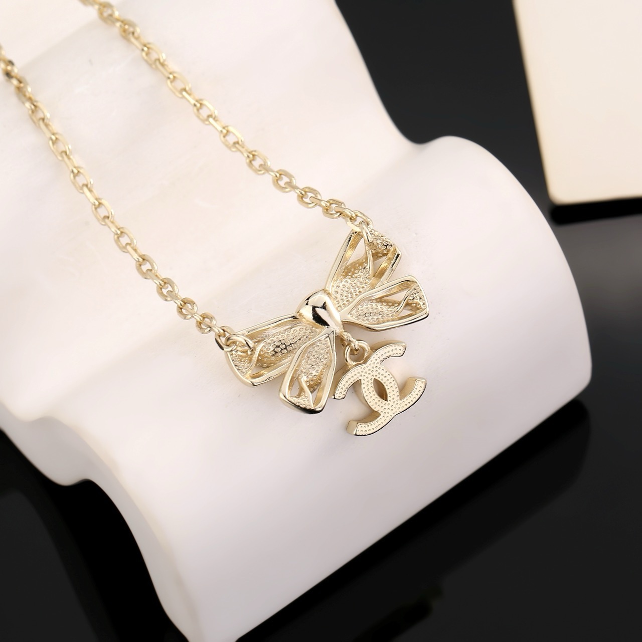 chanel gold crystal bow pendant necklace