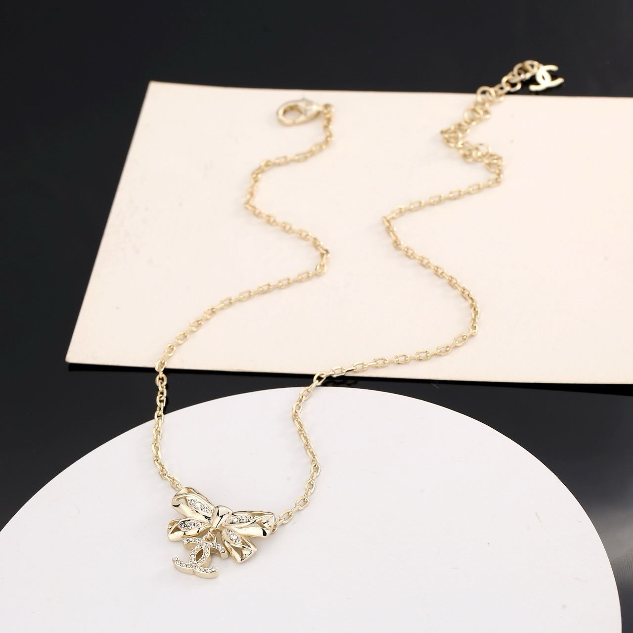 chanel gold crystal bow pendant necklace