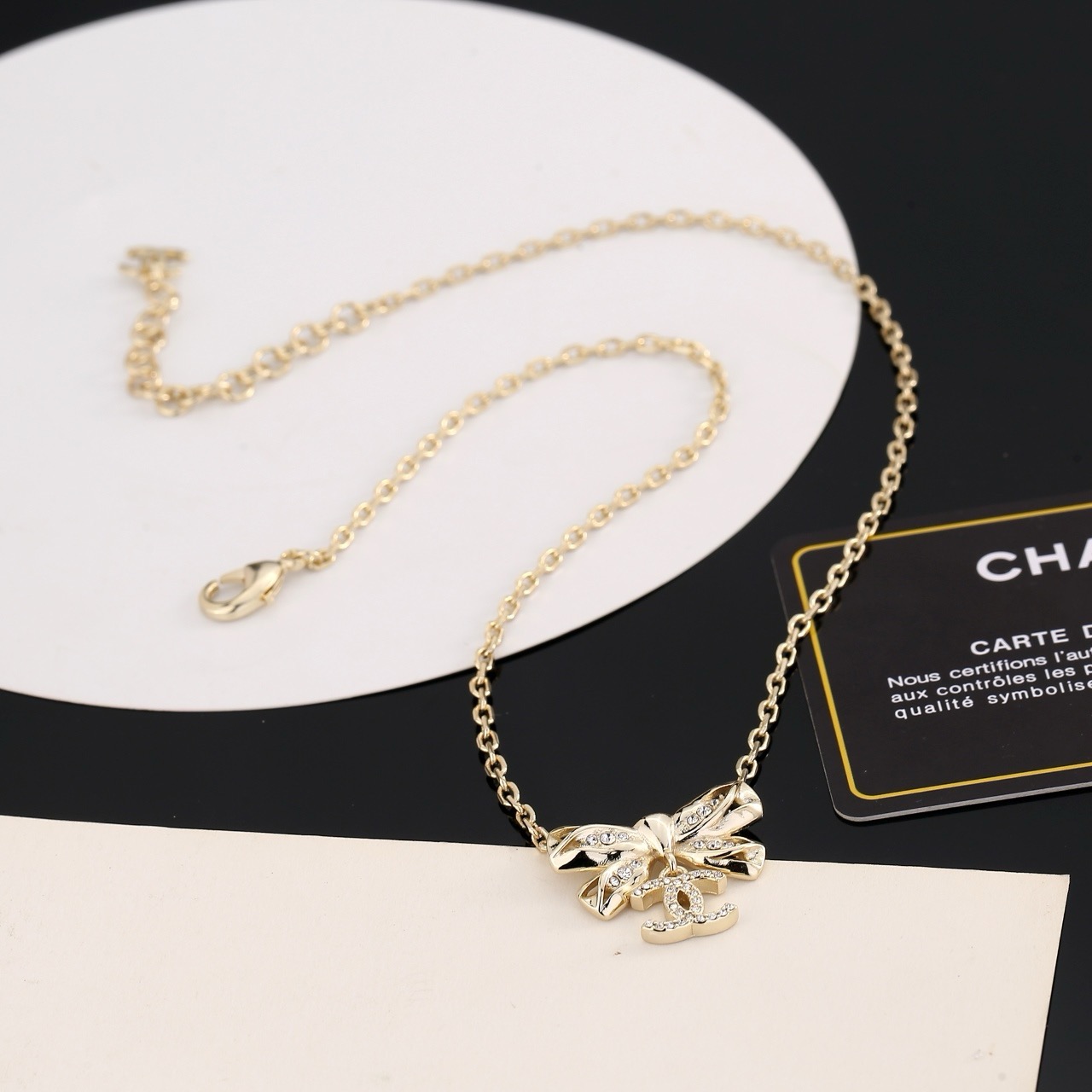 chanel gold crystal bow pendant necklace