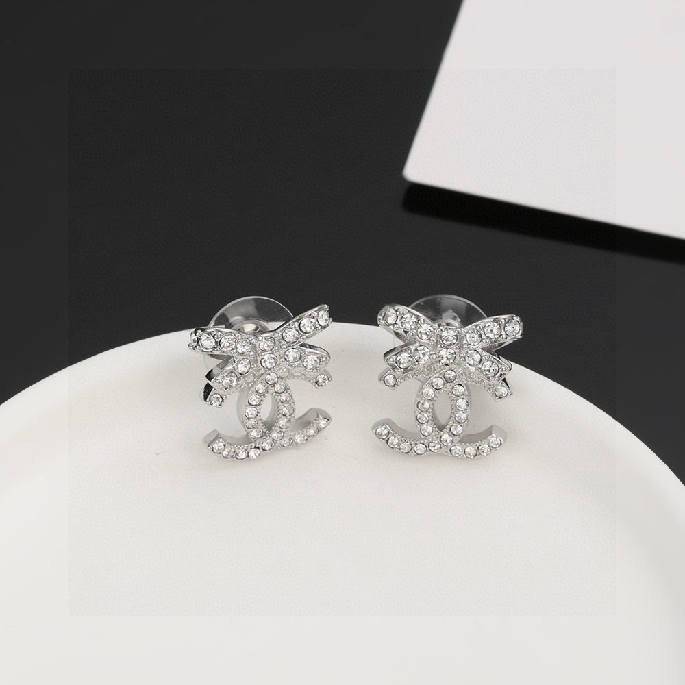 chanel silver crystal bow cc stud earrings