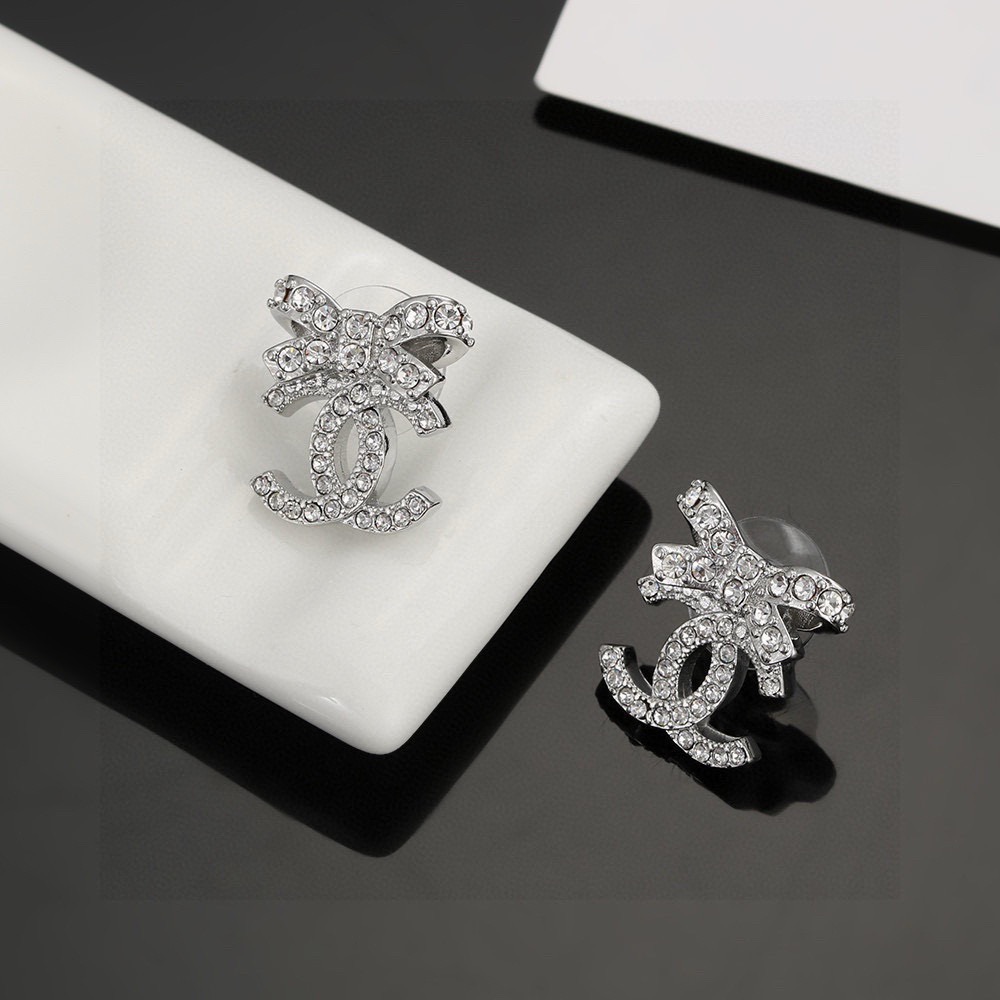 chanel silver crystal bow cc stud earrings