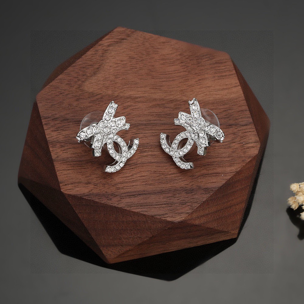 chanel silver crystal bow cc stud earrings