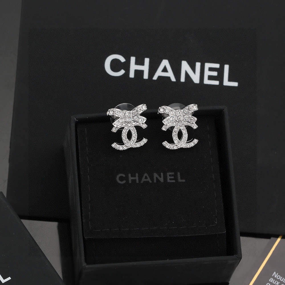chanel silver crystal bow cc stud earrings