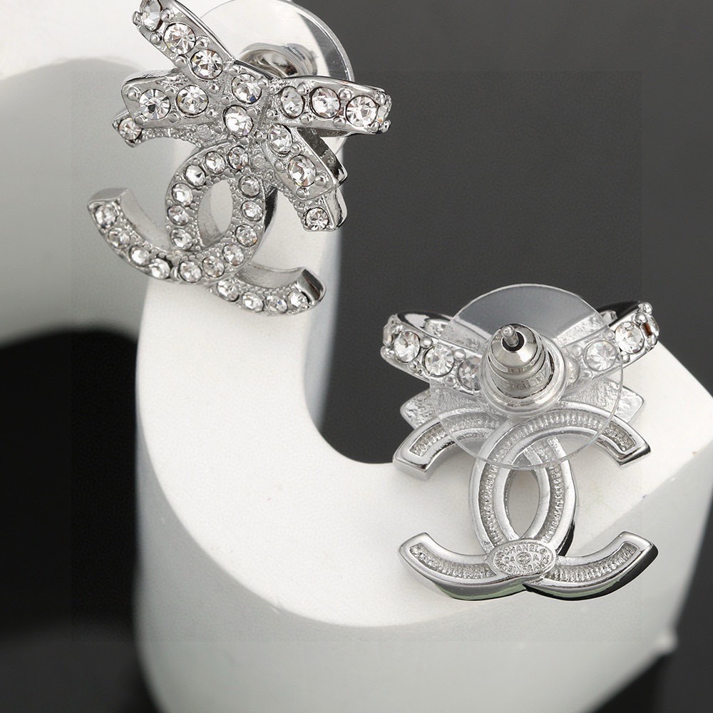 chanel silver crystal bow cc stud earrings