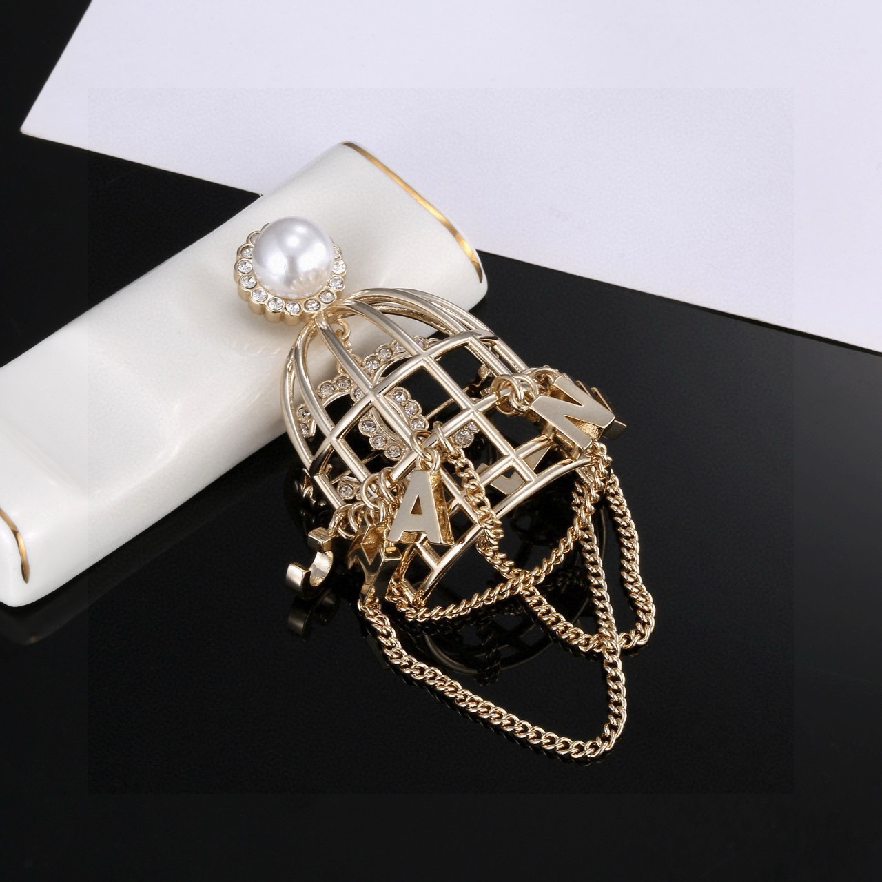 chanel pearl birdcage chain brooch