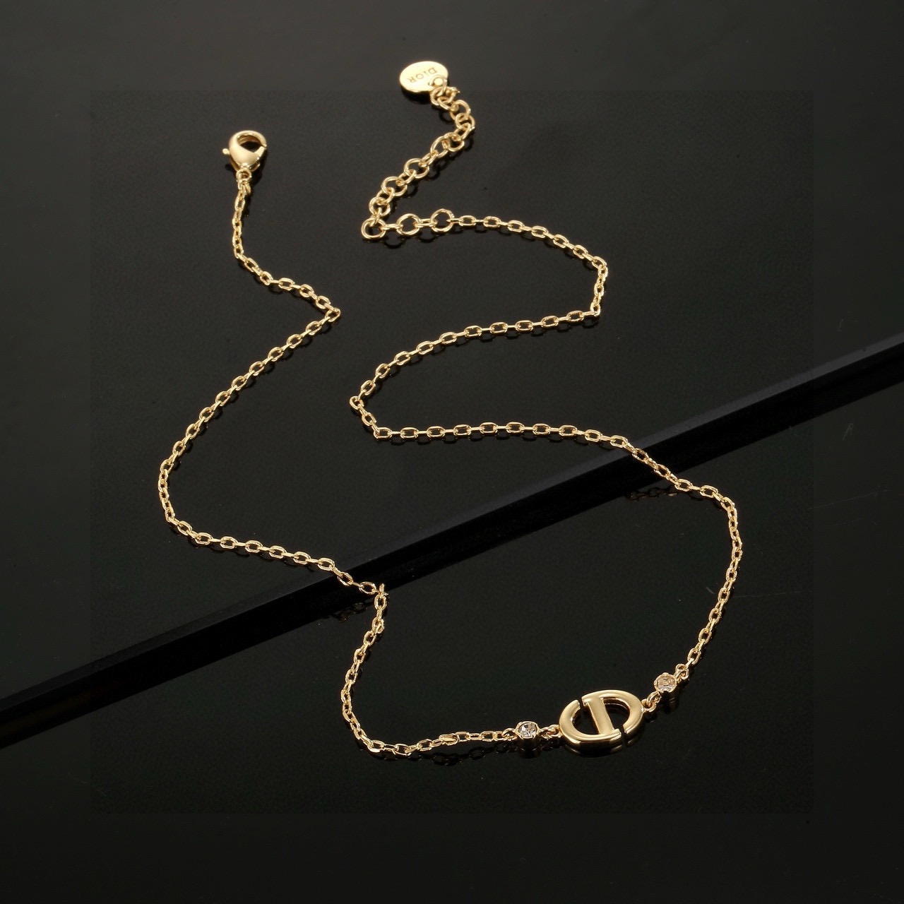 dior gold cd logo circle pendant necklace