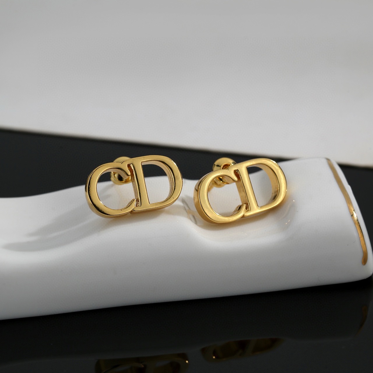 dior gold cd signature stud earrings