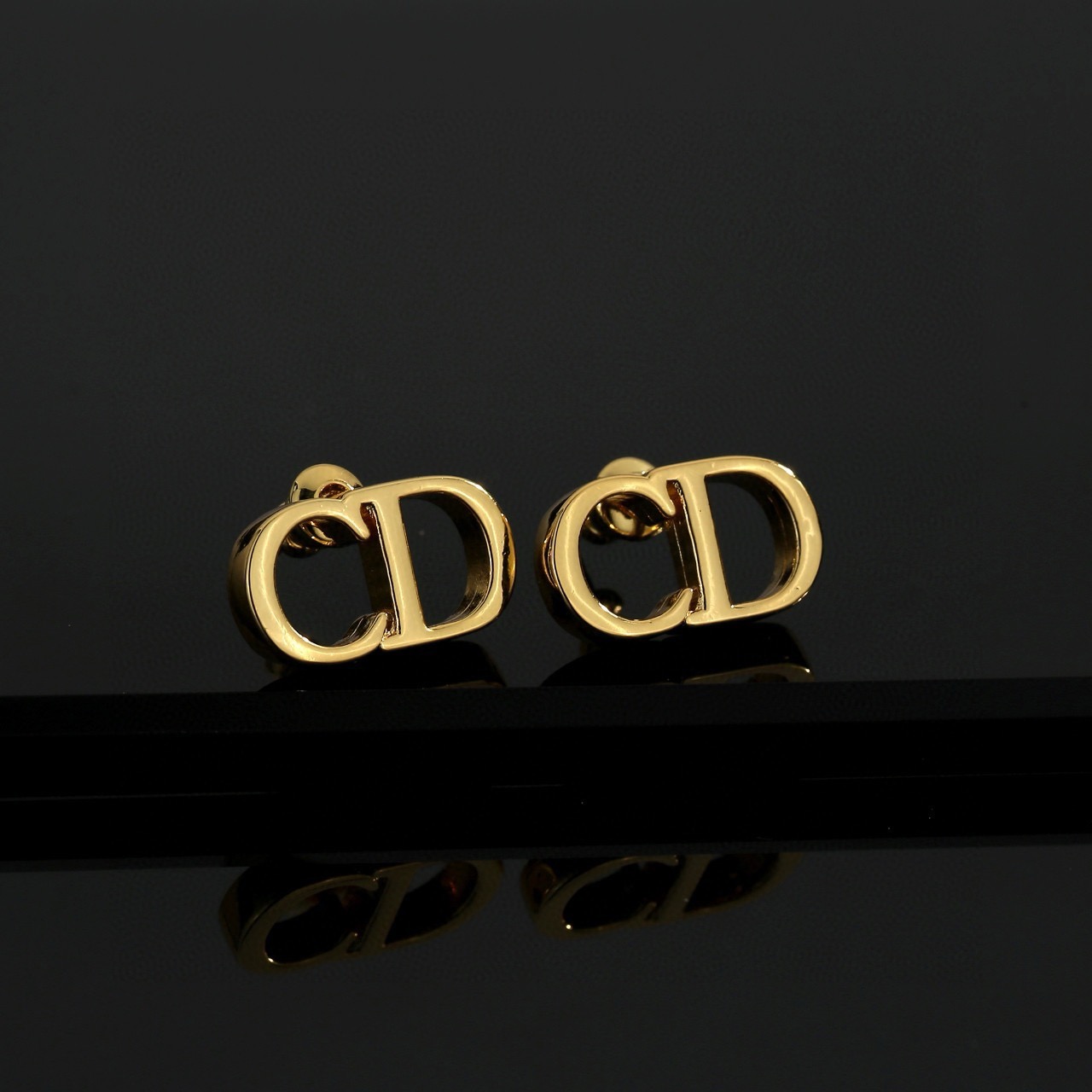 dior gold cd signature stud earrings