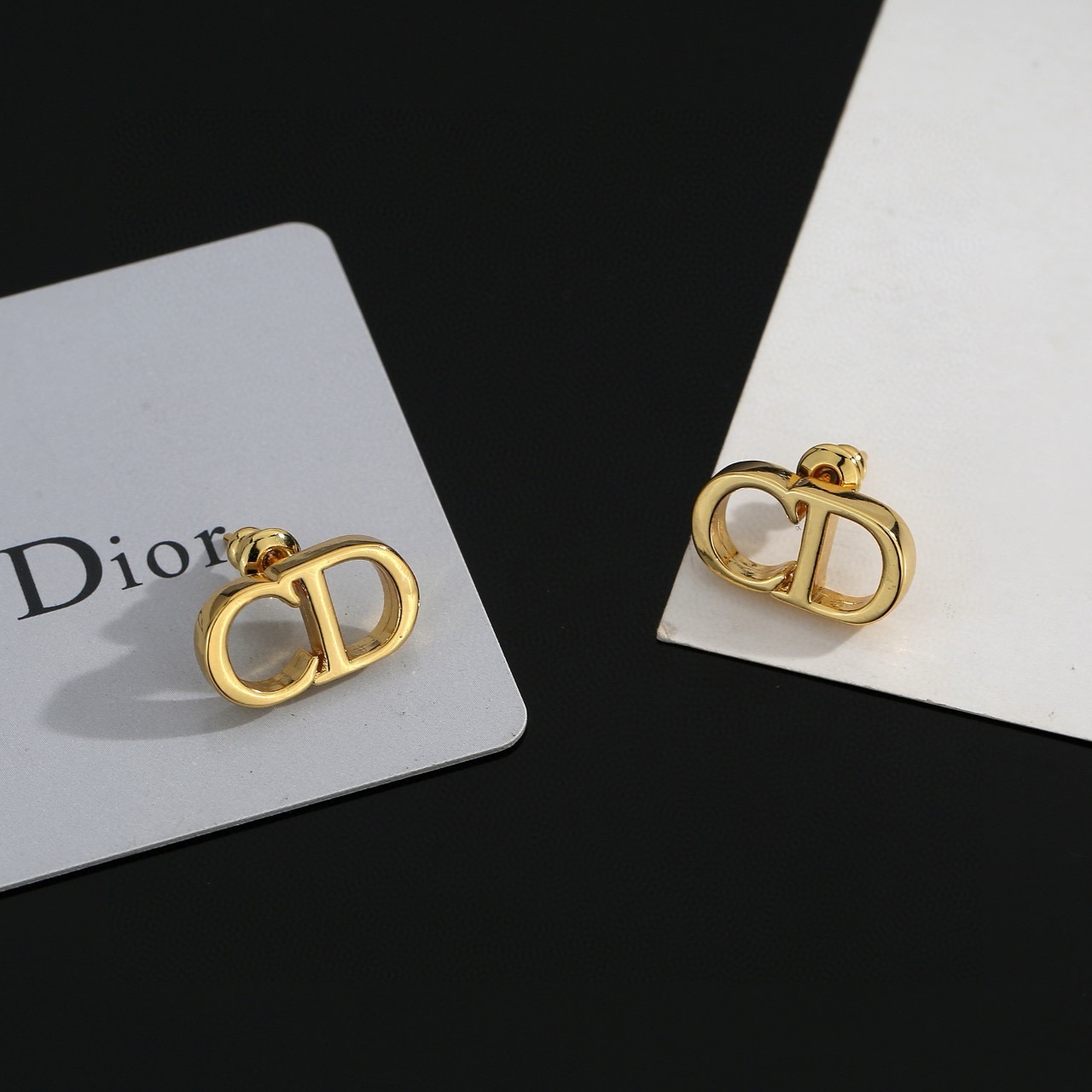dior gold cd signature stud earrings