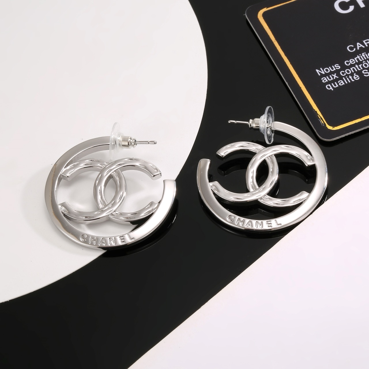 chanel silver interlocking cc hoop earrings