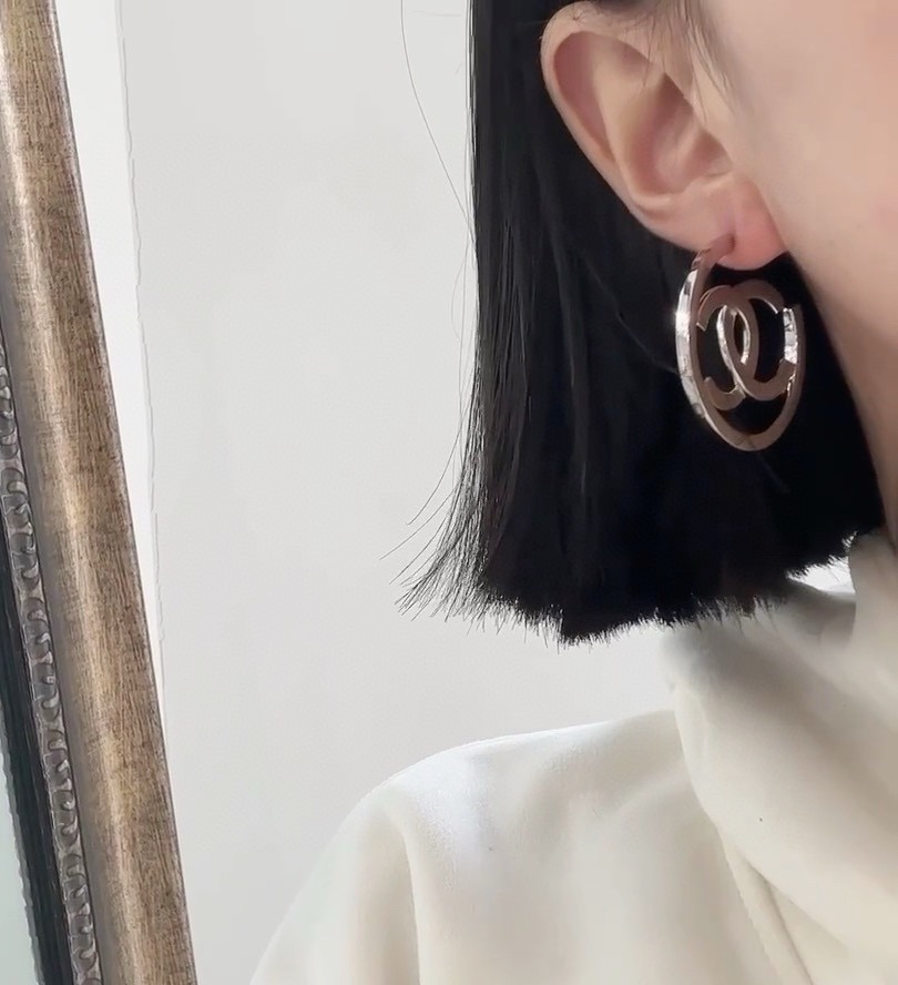 chanel silver interlocking cc hoop earrings