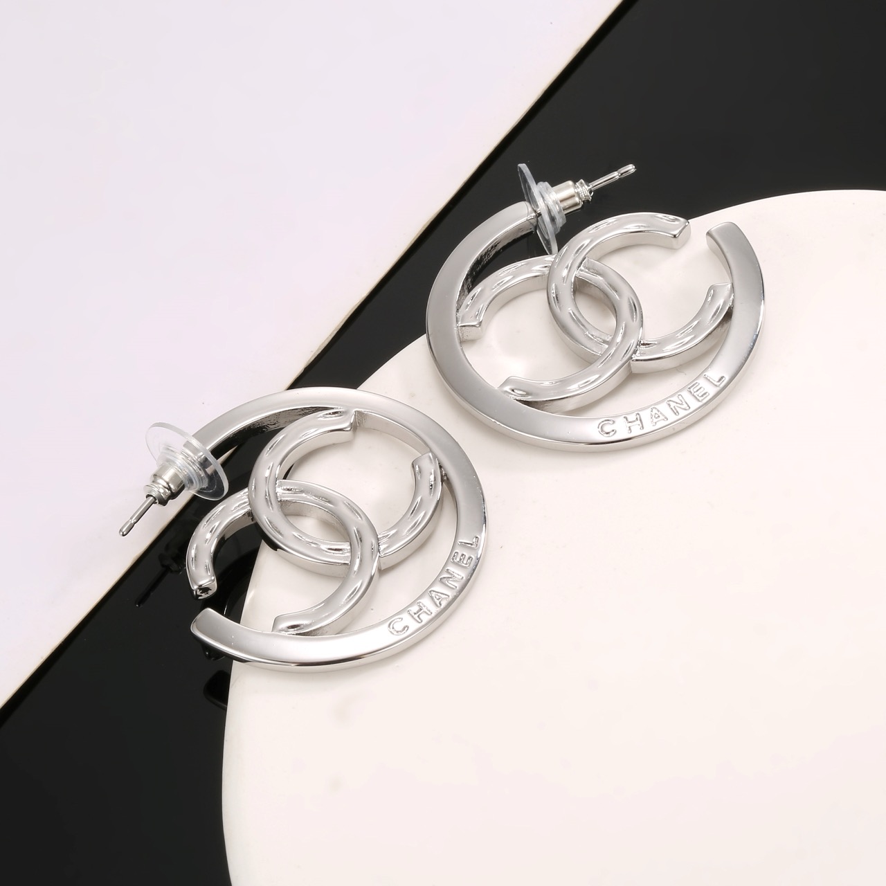 chanel silver interlocking cc hoop earrings