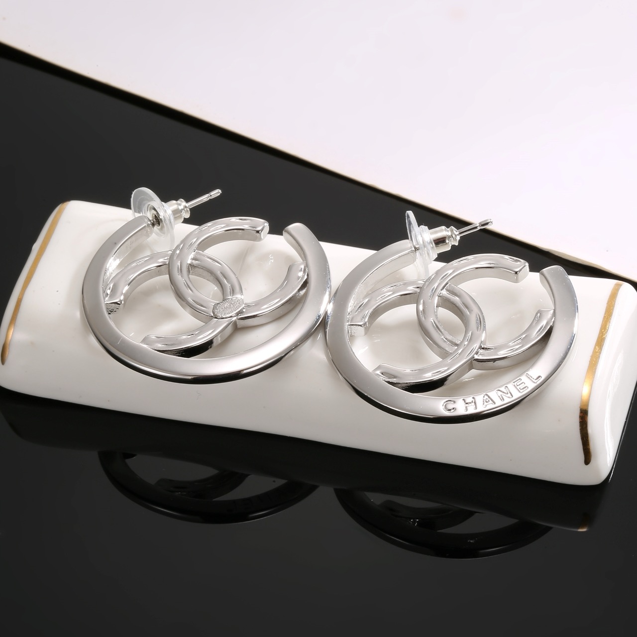 chanel silver interlocking cc hoop earrings