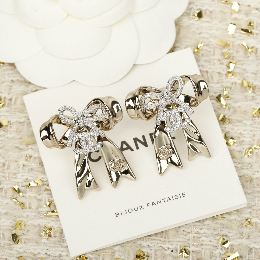 chanel silver crystal cc bow drop earrings