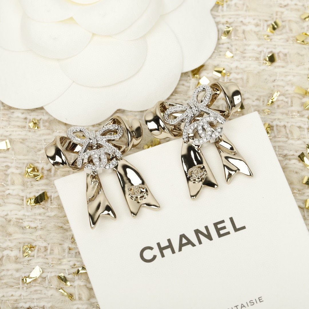 chanel silver crystal cc bow drop earrings