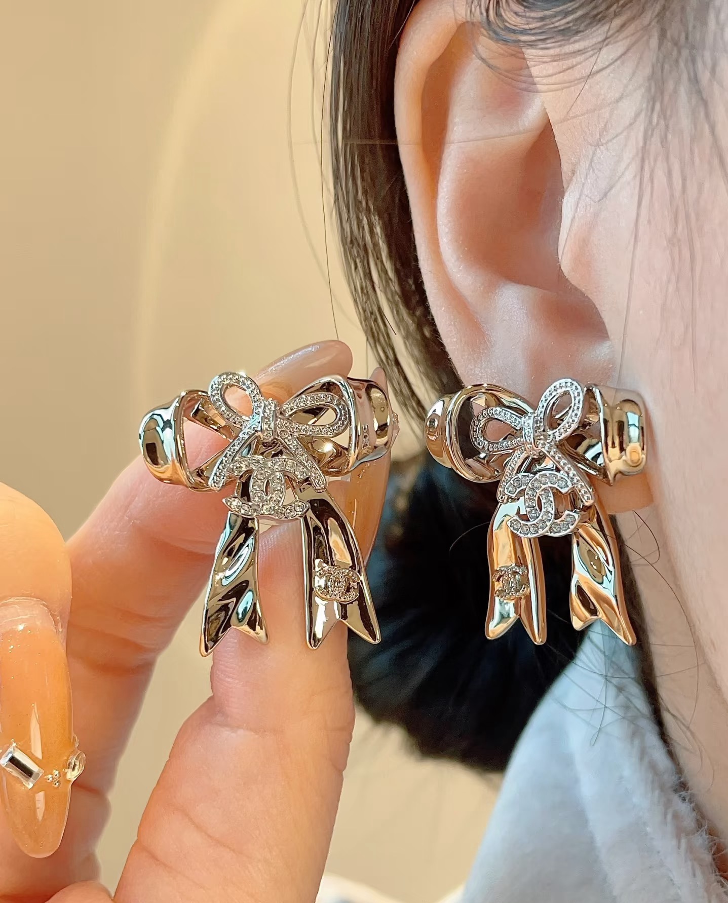 chanel silver crystal cc bow drop earrings