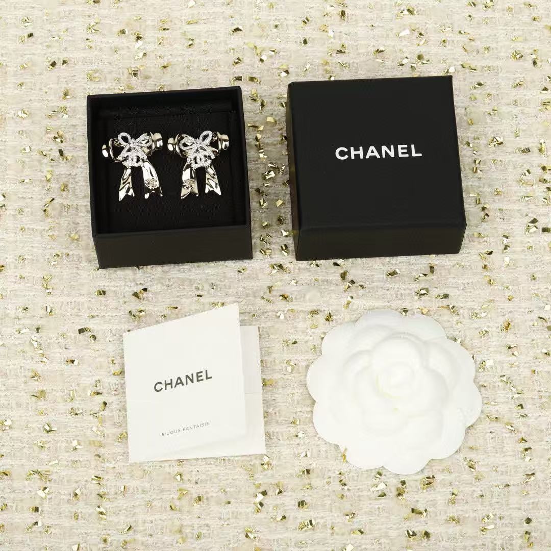 chanel silver crystal cc bow drop earrings