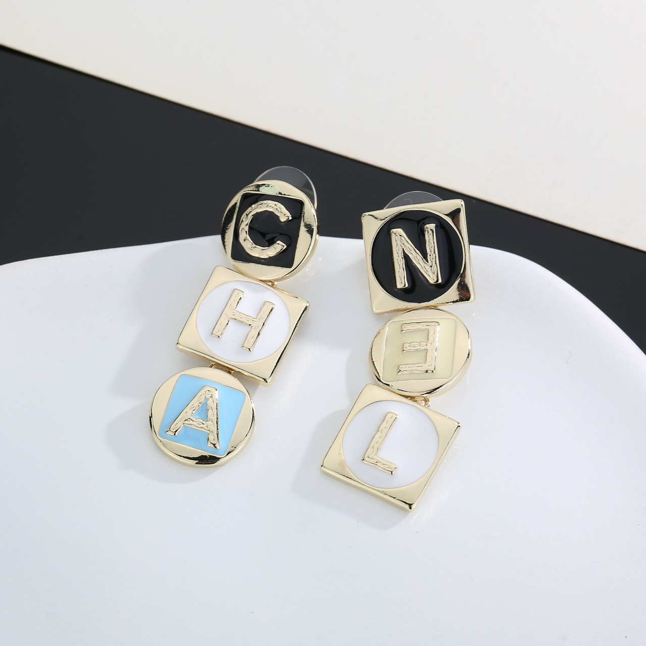 chanel gold multicolor letter drop earrings
