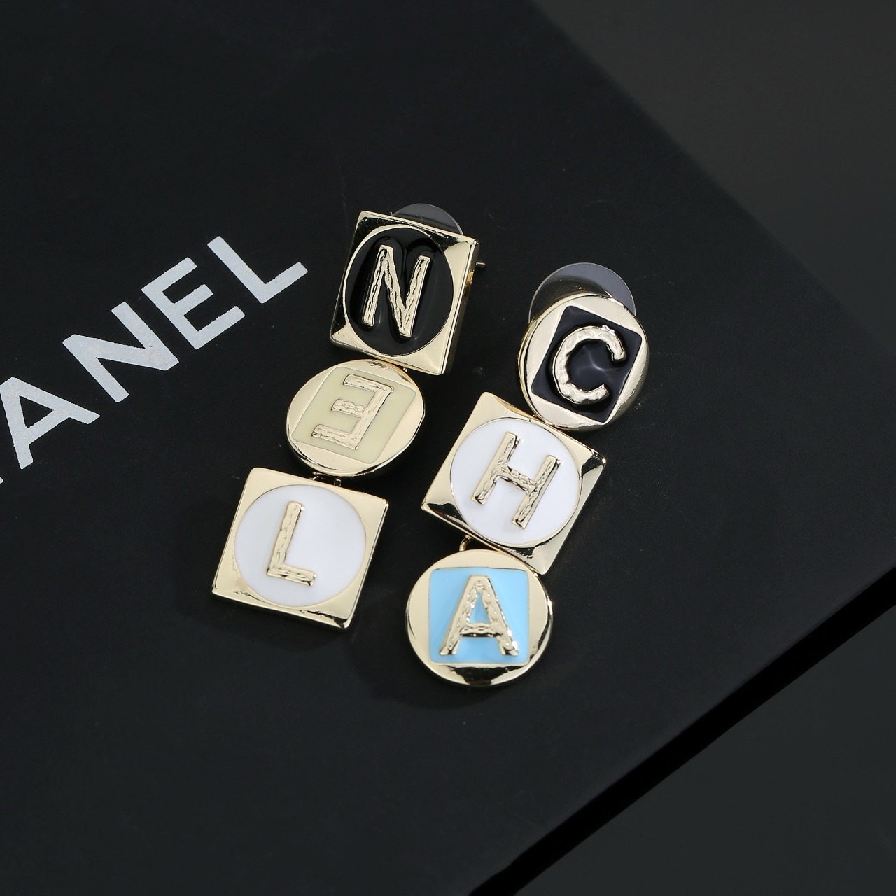 chanel gold multicolor letter drop earrings
