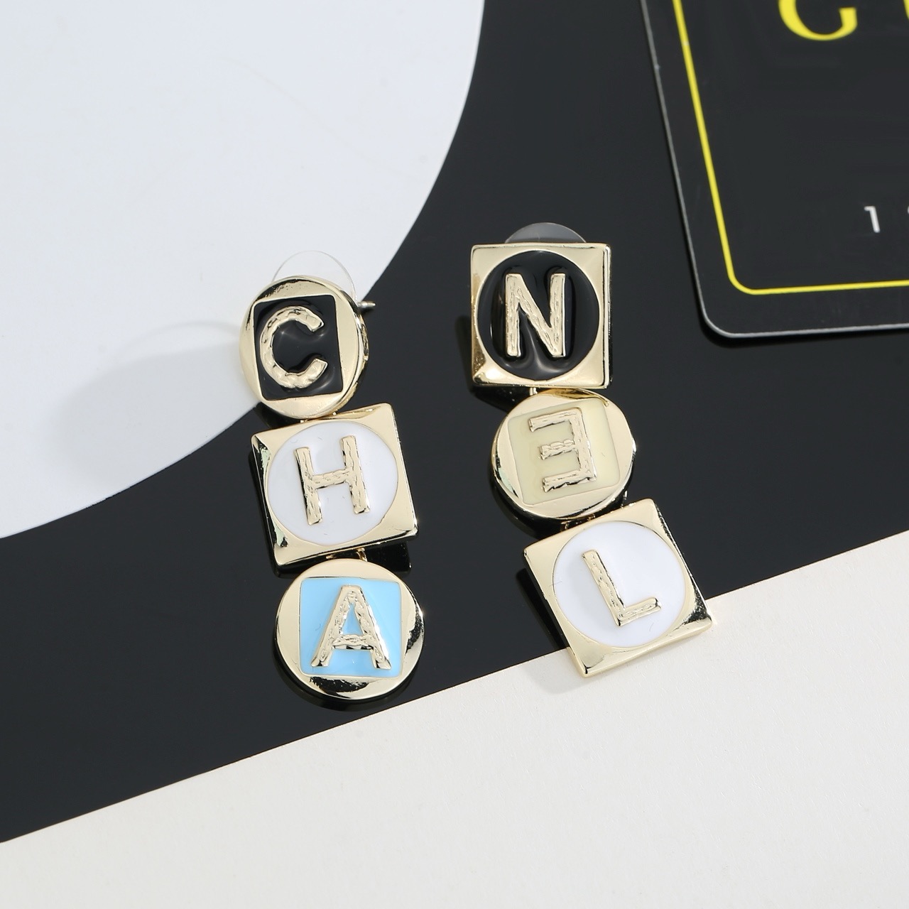 chanel gold multicolor letter drop earrings