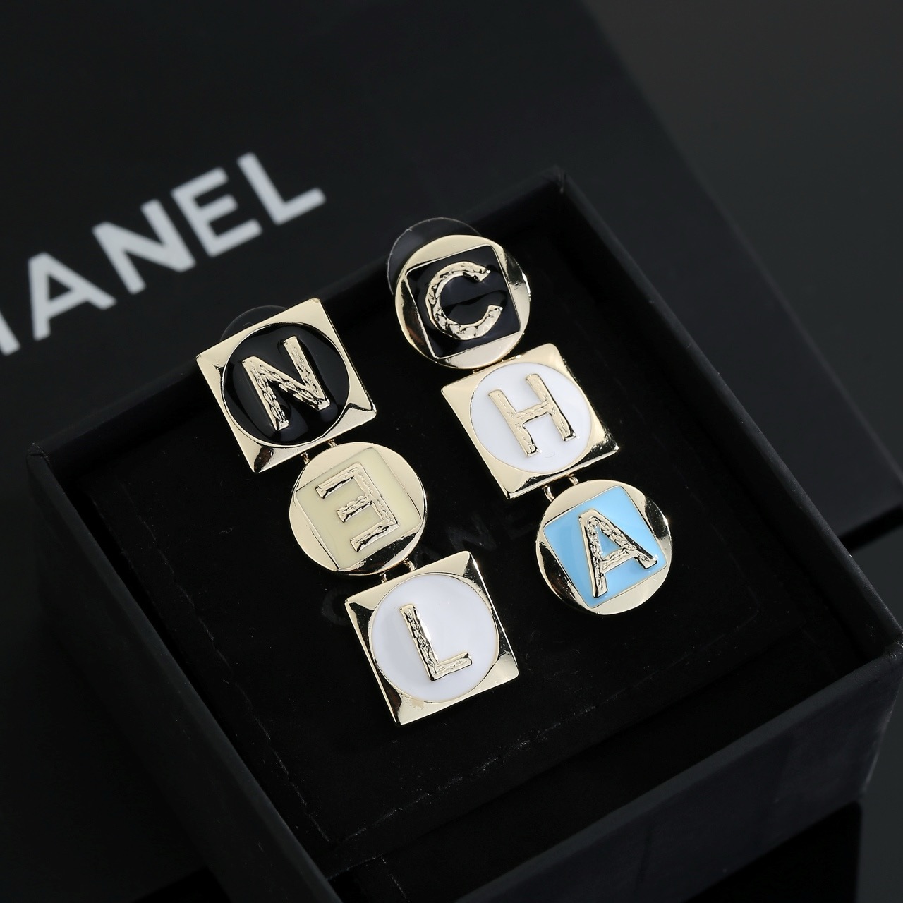chanel gold multicolor letter drop earrings