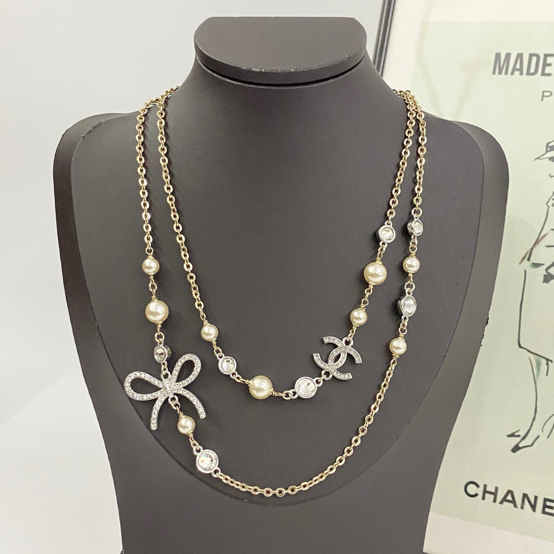 chanel pearl cc crystal bow long necklace