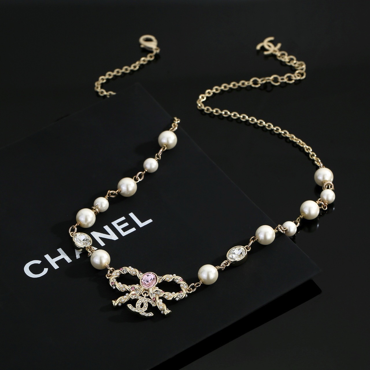 chanel pearl butterfly letter charm necklace