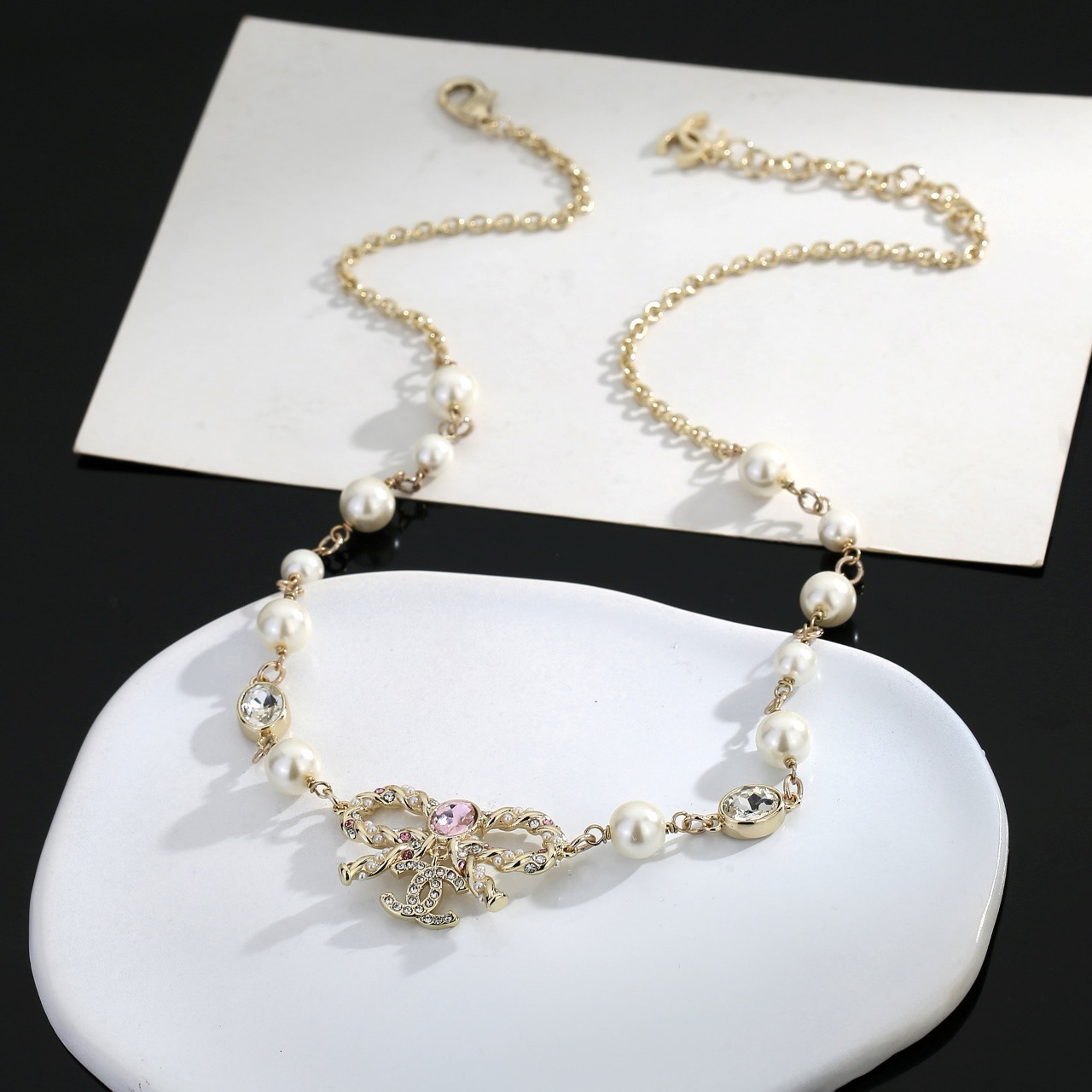 chanel pearl butterfly letter charm necklace