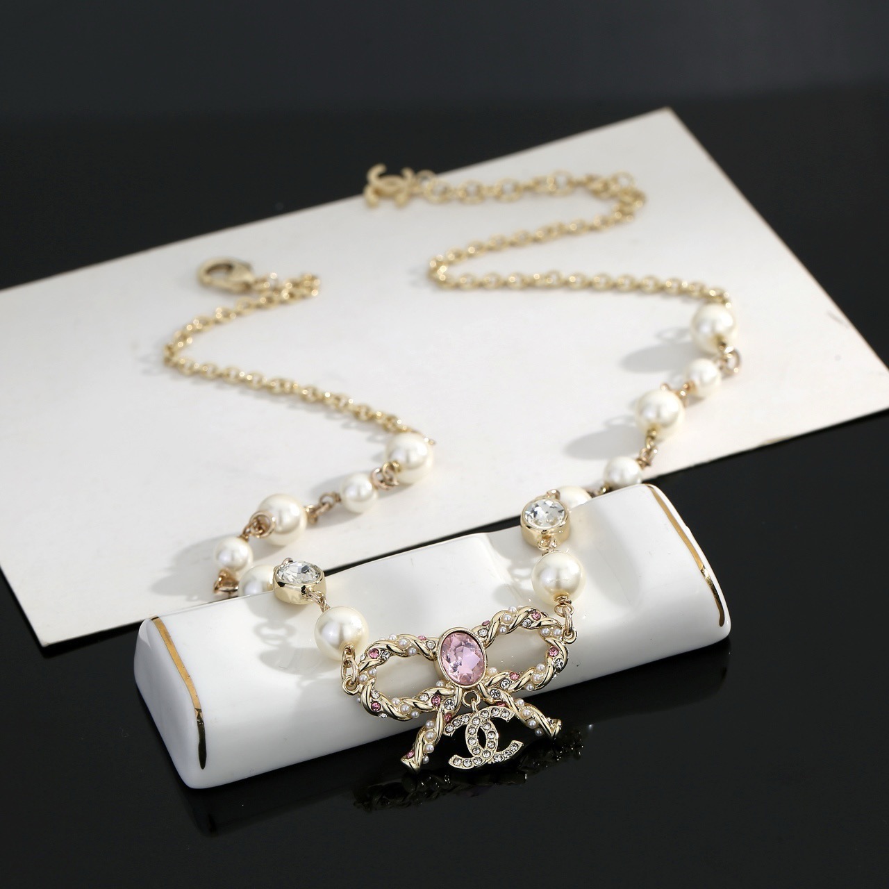 chanel pearl butterfly letter charm necklace