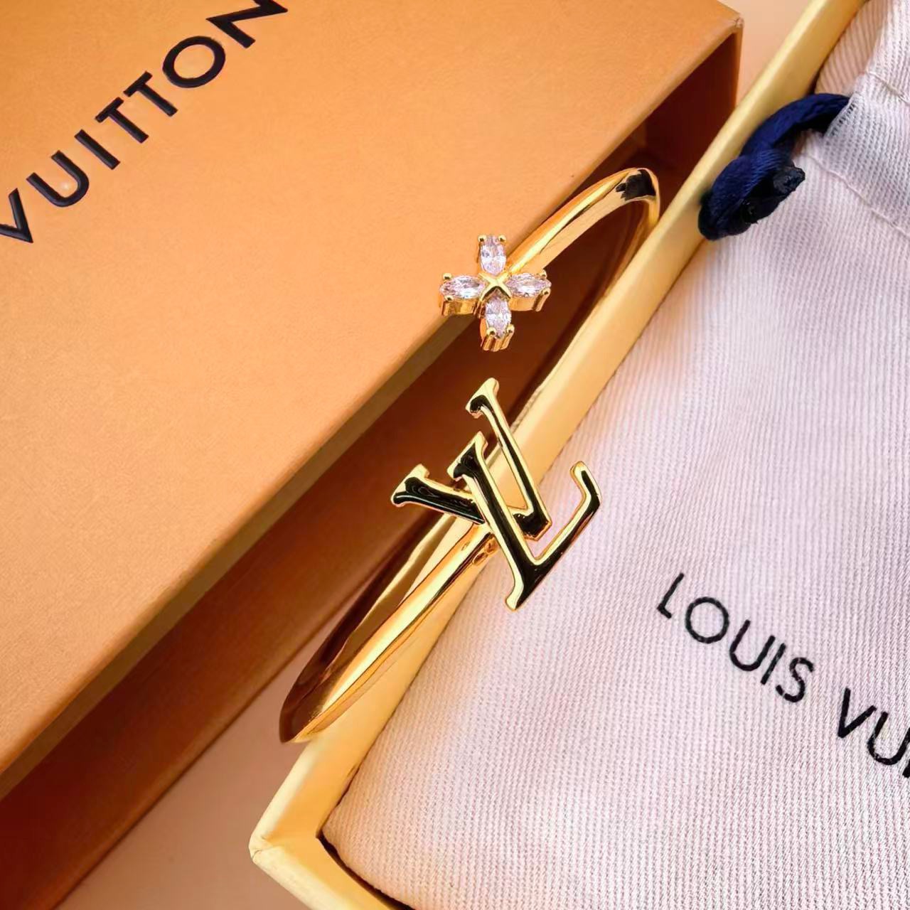 louis vuitton gold lv twig open bangle