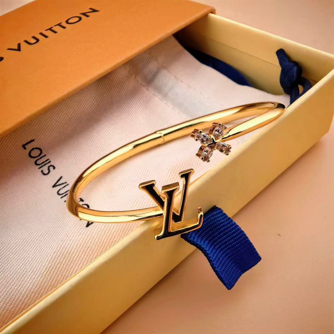 louis vuitton gold lv twig open bangle