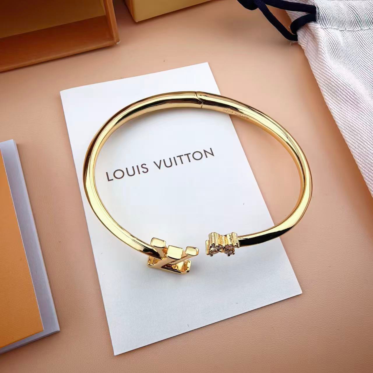 louis vuitton gold lv twig open bangle