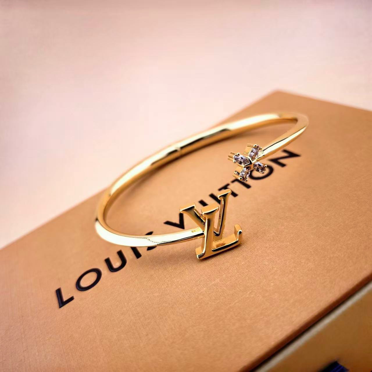louis vuitton gold lv twig open bangle