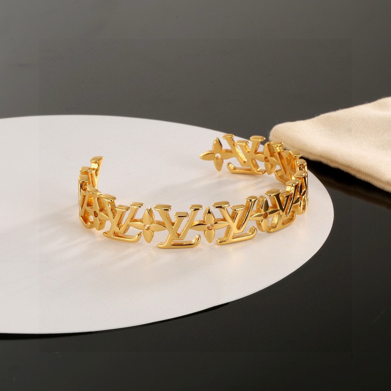 louis vuitton gold lv twig cuff bracelet