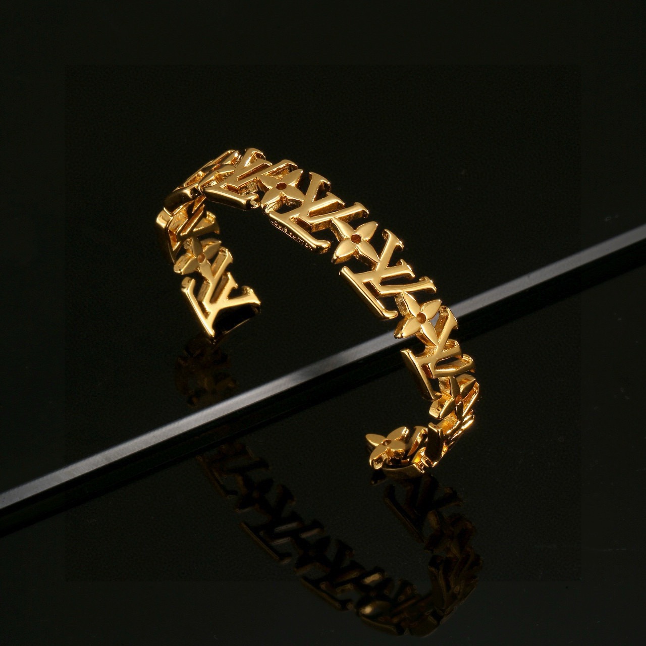 louis vuitton gold lv twig cuff bracelet