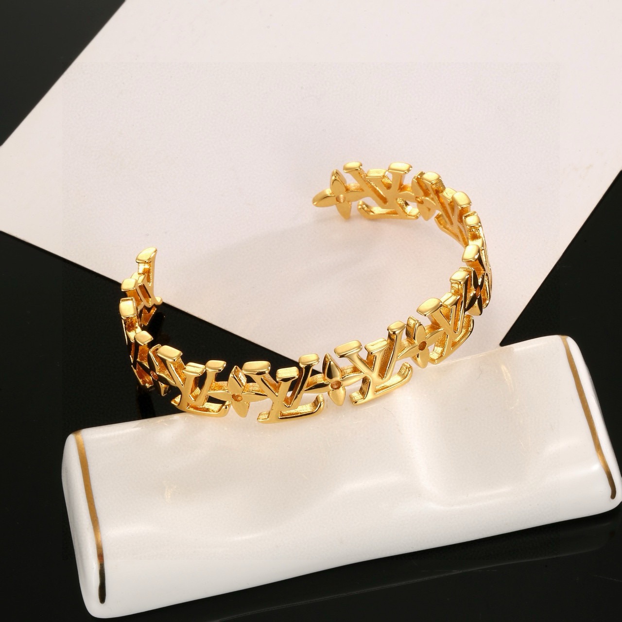 louis vuitton gold lv twig cuff bracelet