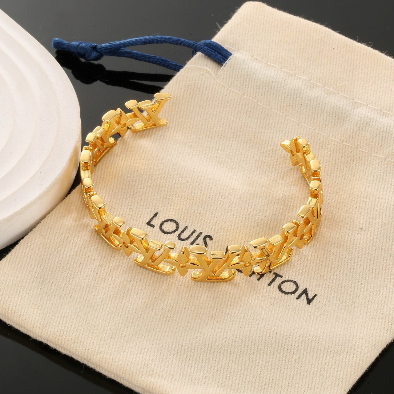 louis vuitton gold lv twig cuff bracelet