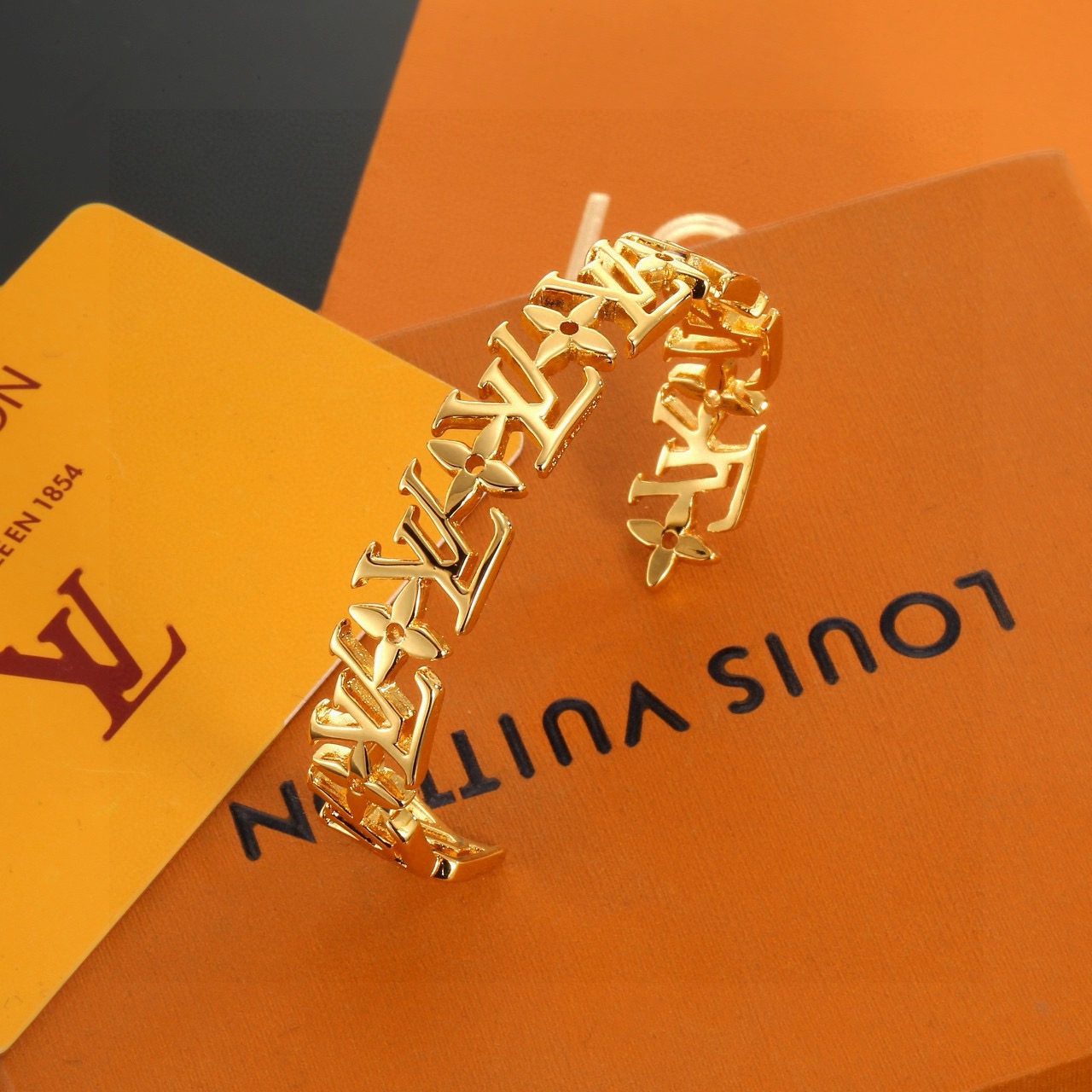 louis vuitton gold lv twig cuff bracelet