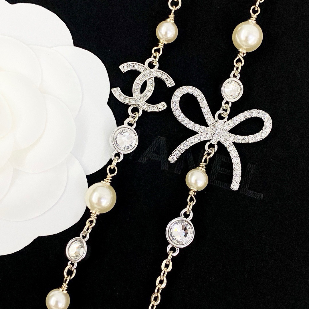chanel pearl crystal bow cc long necklace
