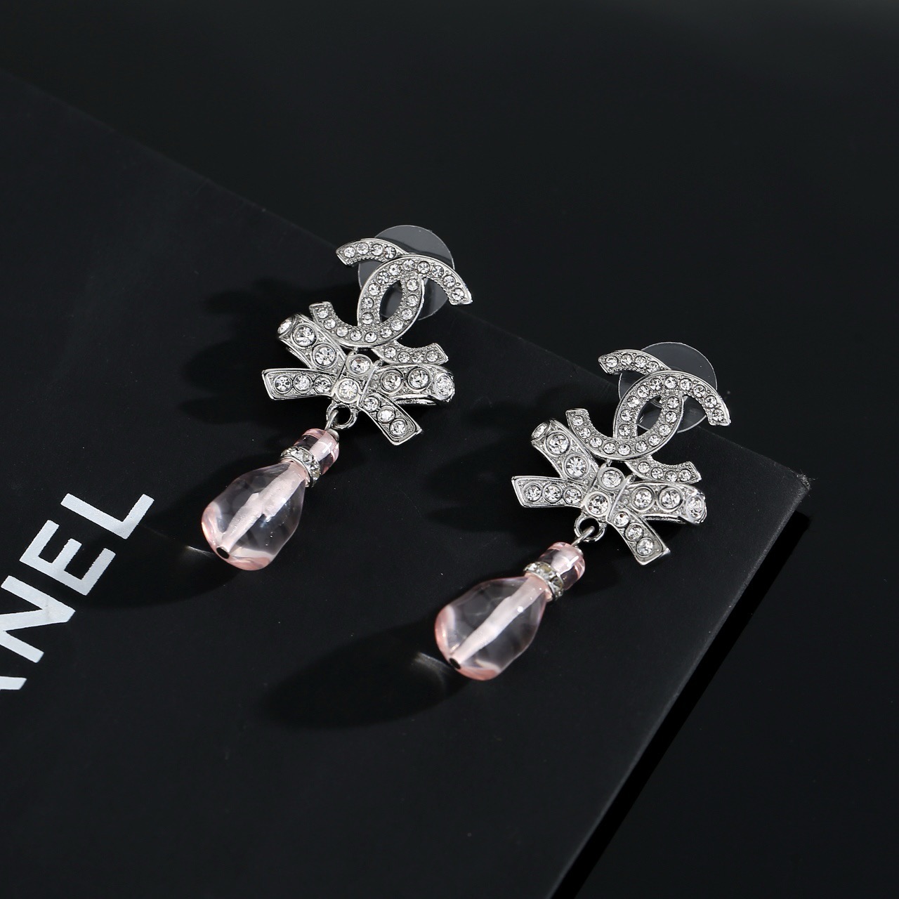 chanel silver bow pink pendant earrings