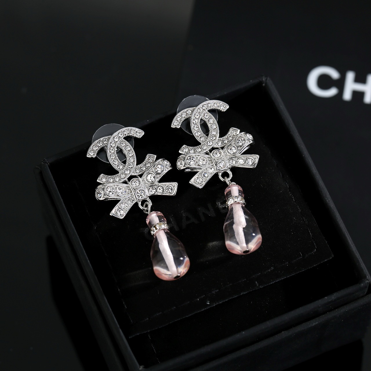 chanel silver bow pink pendant earrings