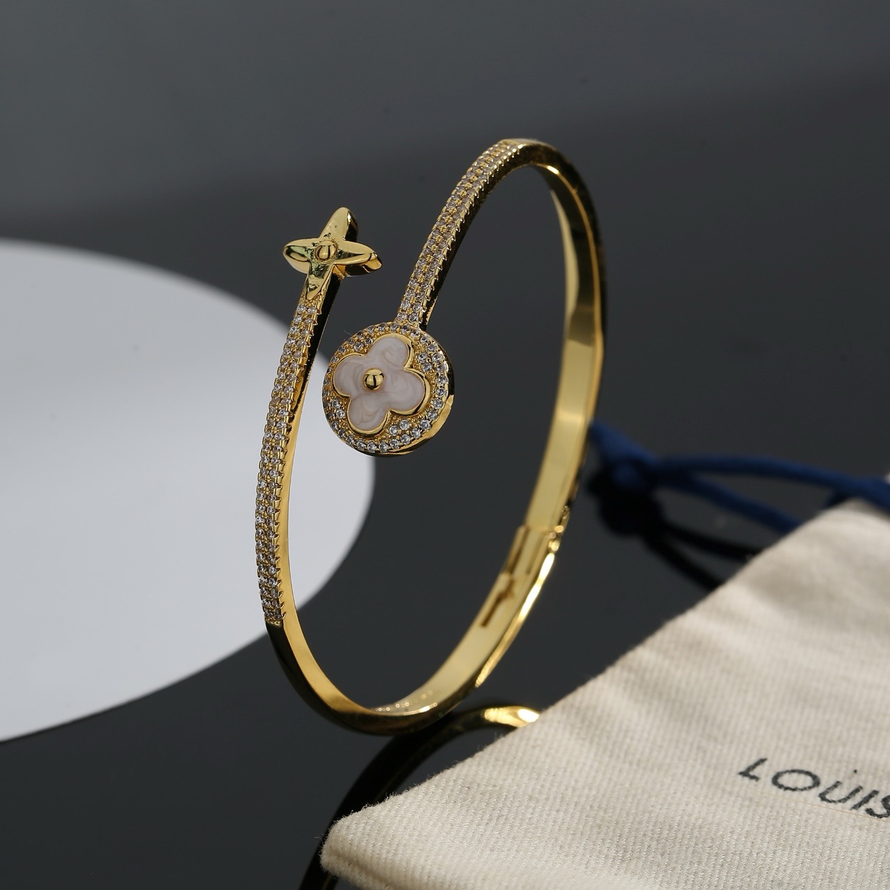 louis vuitton gold lv twig bangle