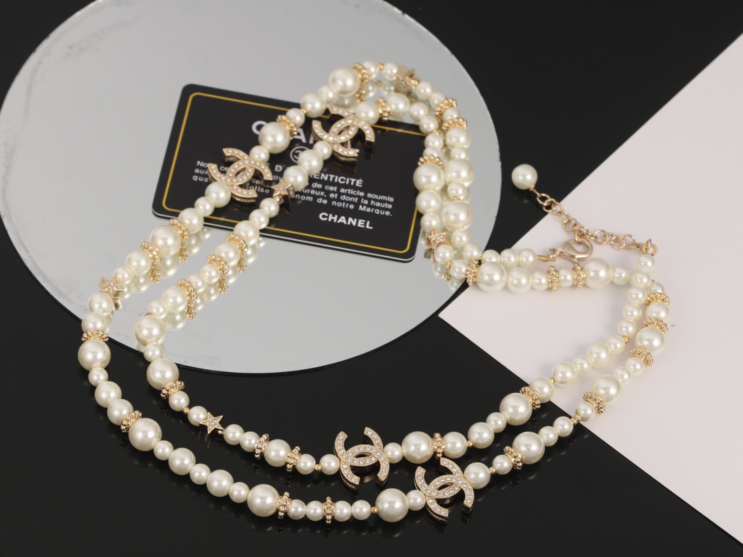 Chanel CC Logo Multi-Charm Pearl Long Necklace necklace Gold-tone metal cream white faux pearl clear crystal 80cm with 5cm extender chain