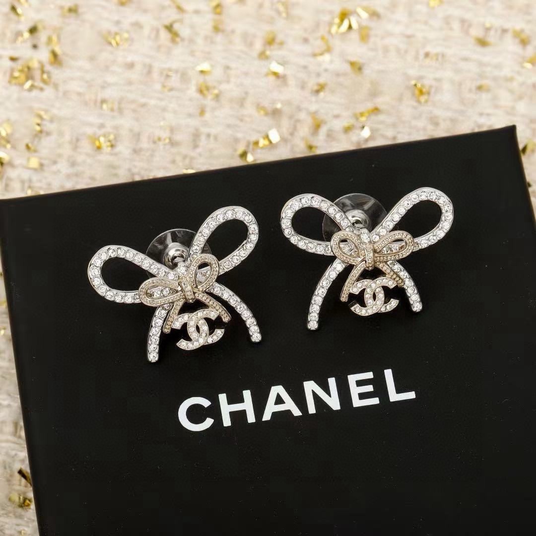 Chanel CC Bow Crystal Stud Earrings earrings silver-toned metal with clear crystal pave light gold-toned bow knot detail 2cm width per earring