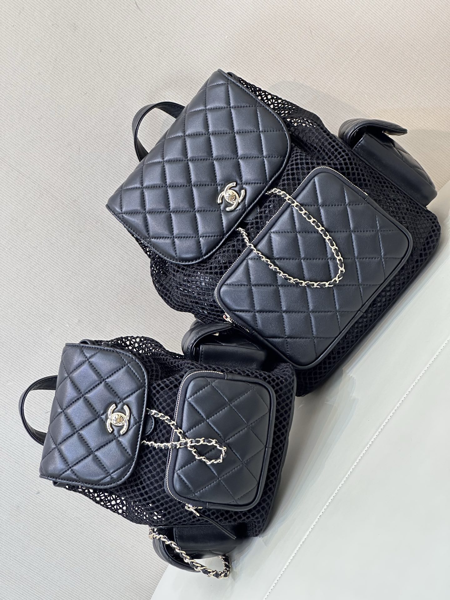 Chanel 25s Mesh Backpack, Quilted Design with CC Logo, Chain Accents 3 i1745314624240 5997 0 1