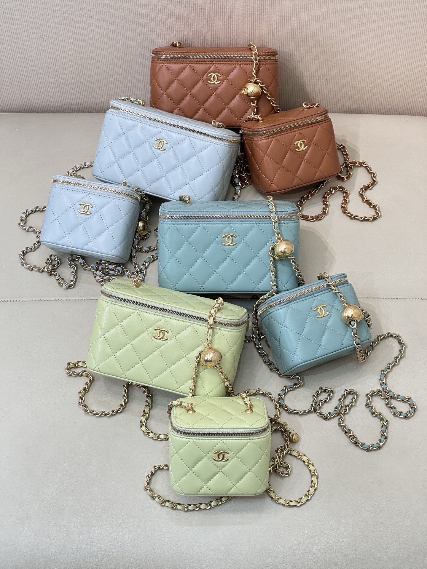 Chanel Gold Ball Vanity Bag: Lambskin Leather, Adjustable Chain, and Chic Design